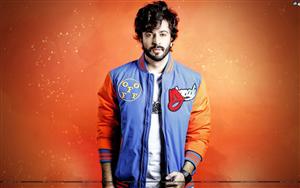 An Indian actor and model, Dheeraj Dhoopar gives a fine-looking pose in a blue-orange jacket